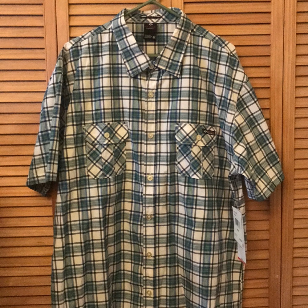Men’s plaid button down shirt sleeve.